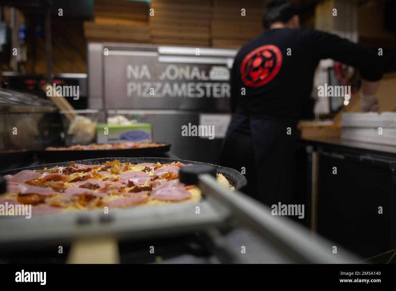 Food is prepared for U.S. Marines and Sailors with II Marine Expeditionary Force to watch Super Bowl LVI in Setermoen, Norway, Feb. 13, 2022. The event was catered by a local food establishment and brought together Marines and Sailors from Exercise Cold Response 22 to watch the sporting event. Stock Photo