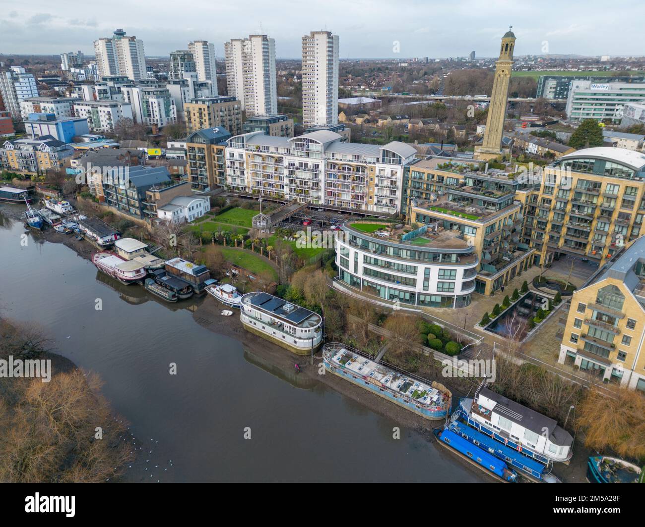 Aeiral view of apartment blocks developed on the riverside of the River Thames beside Kew Bridge