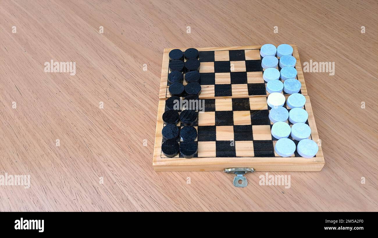 Checkerboard with checkers Business strategy planning. Plastic