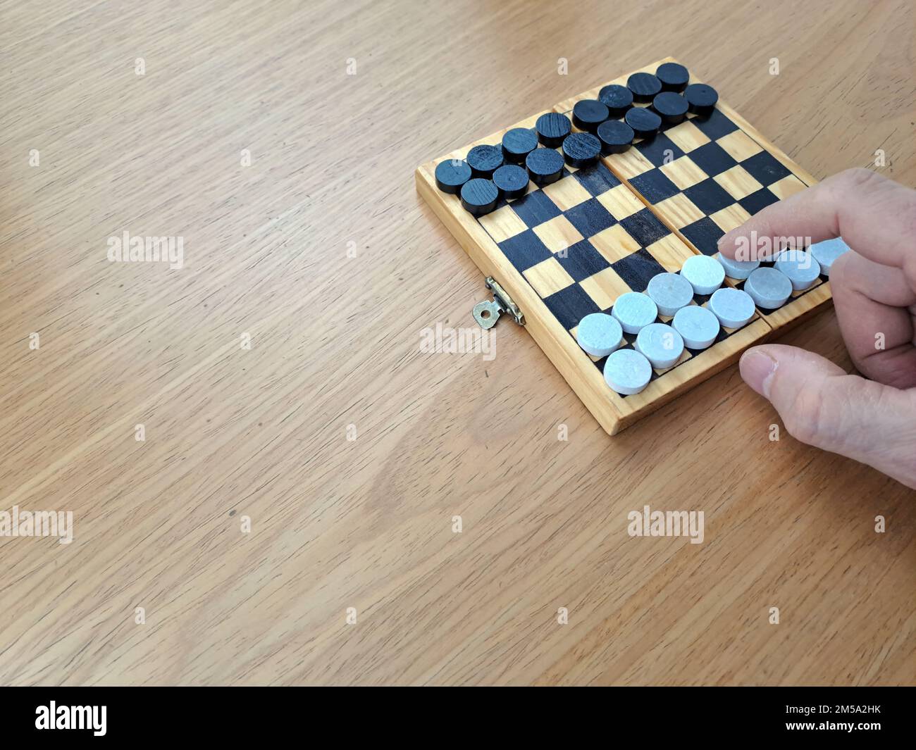 Checkerboard with checkers Business strategy planning. Plastic