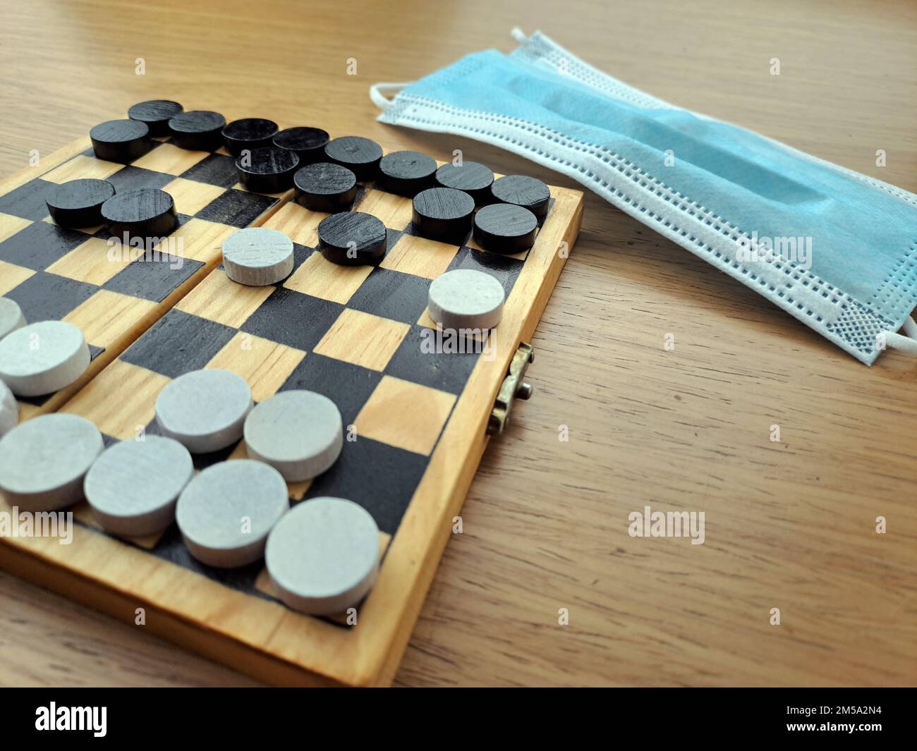 Checkerboard with checkers Business strategy planning. Plastic