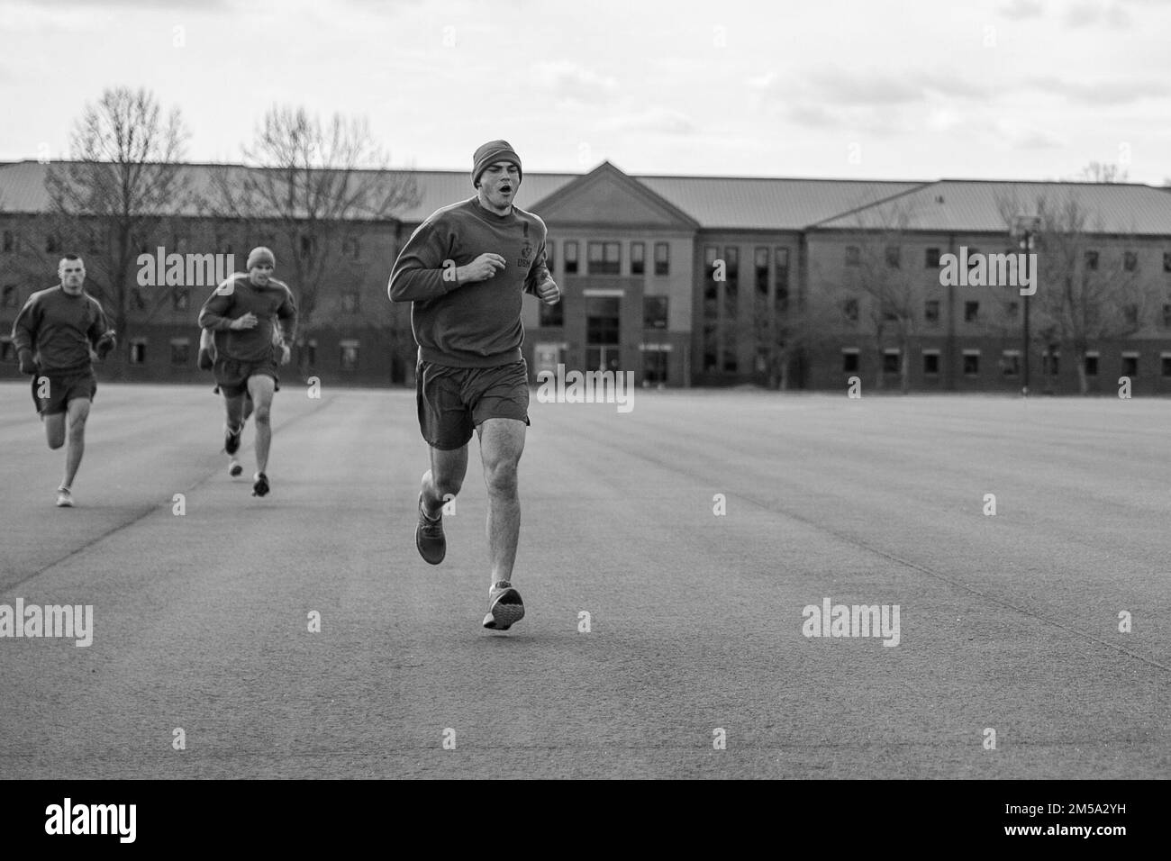 Candidates from Alpha and Delta Co., OCC-239,  conduct their final Physical Fitness Test (PFT) on  Marine Corps Base Quantico, VA., Feb. 14, 2022. The  purpose of the PFT is to evaluate a candidate's ability  to meet commissioning standards and to assess  overall physical fitness. Stock Photo