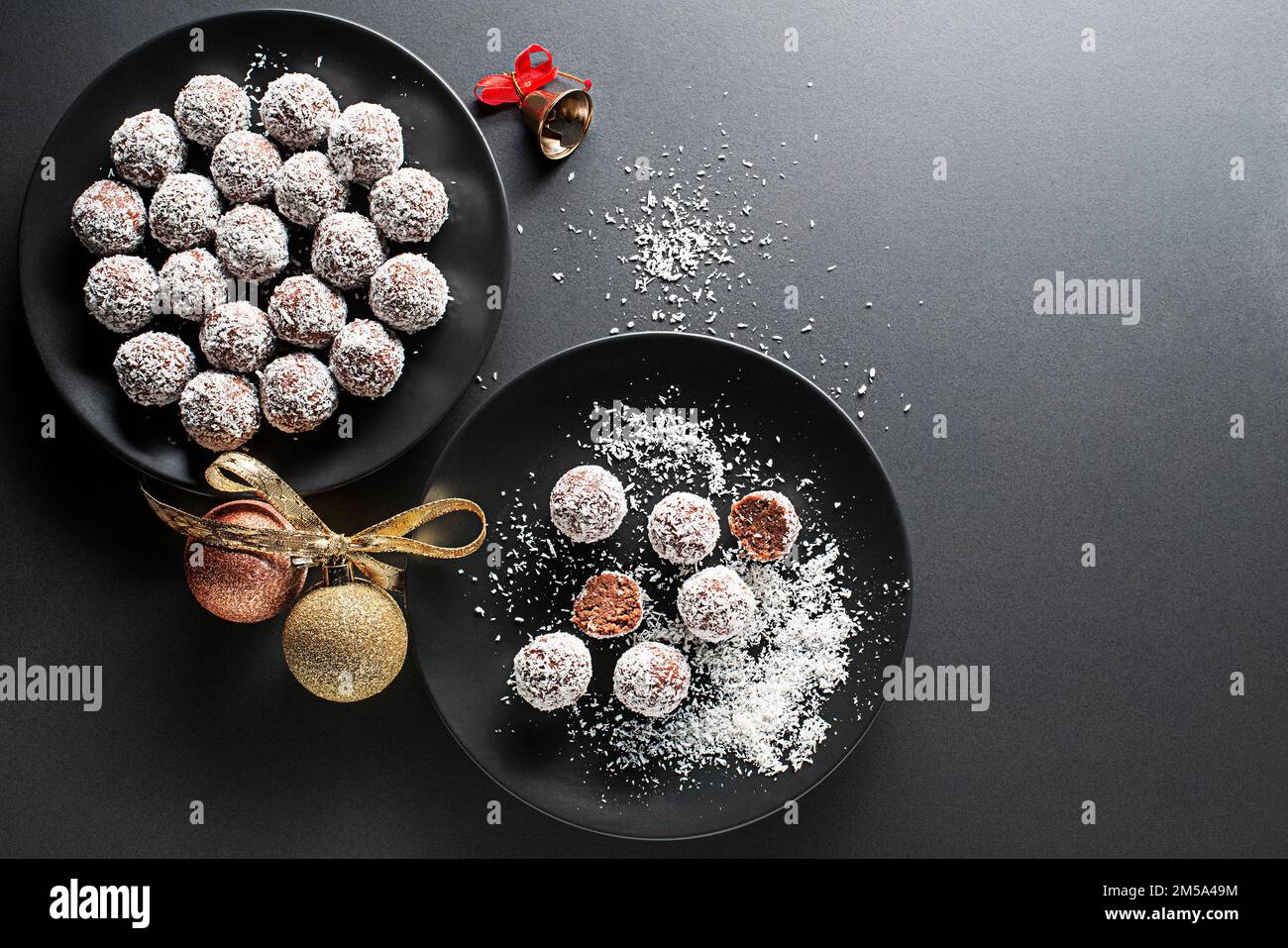 Delicious CoconutChocolate balls covered with grated coconut. Soft, delicious and fudgy coconut