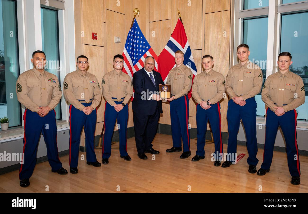 OSLO, Norway (Feb. 14, 2022) — Secretary of the Navy Carlos Del Toro presents an award for physical fitness to U.S. Marines assigned to Marine Security Guard, Detachment Oslo in Oslo, Norway, Feb. 14, 2022. Secretary Del Toro is in Norway to visit U.S. service members and Norwegian government leaders to reinforce existing bilateral and multilateral security relationships between the U.S. Navy and the Royal Norwegian Navy. Stock Photo