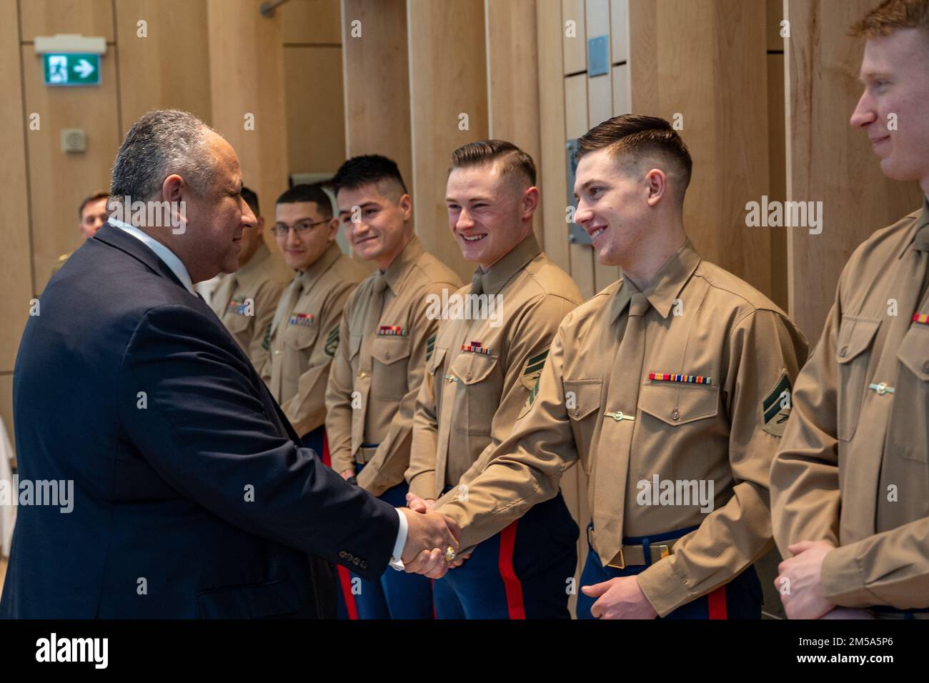 OSLO, Norway (Feb. 14, 2022) — Secretary of the Navy Carlos Del Toro greets U.S. Marines assigned to Marine Security Guard, Detachment Oslo in Oslo, Norway, Feb. 14, 2022. Secretary Del Toro is in Norway to visit U.S. service members and Norwegian government leaders to reinforce existing bilateral and multilateral security relationships between the U.S. Navy and the Royal Norwegian Navy. Stock Photo