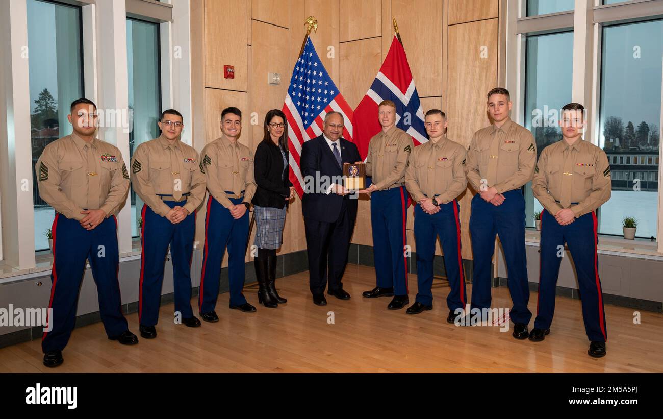 OSLO, Norway (Feb. 14, 2022) — Secretary of the Navy Carlos Del Toro presents an award for physical fitness to U.S. Marines assigned to Marine Security Guard, Detachment Oslo in Oslo, Norway, Feb. 14, 2022. Secretary Del Toro is in Norway to visit U.S. service members and Norwegian government leaders to reinforce existing bilateral and multilateral security relationships between the U.S. Navy and the Royal Norwegian Navy. Stock Photo