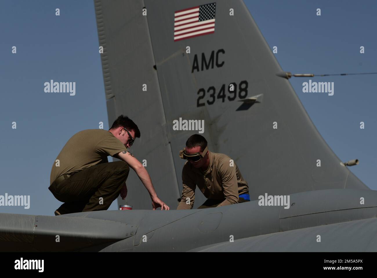 U.S. Air Force Airmen assigned to the 379th Expeditionary Aircraft Maintenance Squadron at Al Udeid Air Base, Qatar, performs maintenance on a KC-135 Stratotanker aircraft at Prince Sultan Air Base, Kingdom of Saudi Arabia, Feb. 15, 2022. The 379th EAMXS was at PSAB participating in Joint Air Defense Exercise 22-01, a theater-wide large-scale integrated air and missile defense exercise. Stock Photo