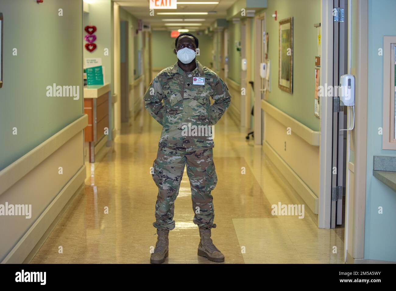 Spc. Muhammad Lebbie, an infantrymen with the 1st Battalion, 175th Infantry Regiment C Company, poses for a photo at Doctors Community Hospital Luminous in Lanham, Maryland, on Feb. 14, 2022. Lebbie is proud of his service and wants to do all he can to help end the COVID-19 pandemic. At the direction of Gov. Larry Hogan, up to 1,000 MDNG members were activated to assist state and local health officials with their COVID-19 response to include the distribution of COVID-19 test kits, 20 million KN95 and N95 masks, and other personal protective equipment and to provide support to skilled nursing f Stock Photo