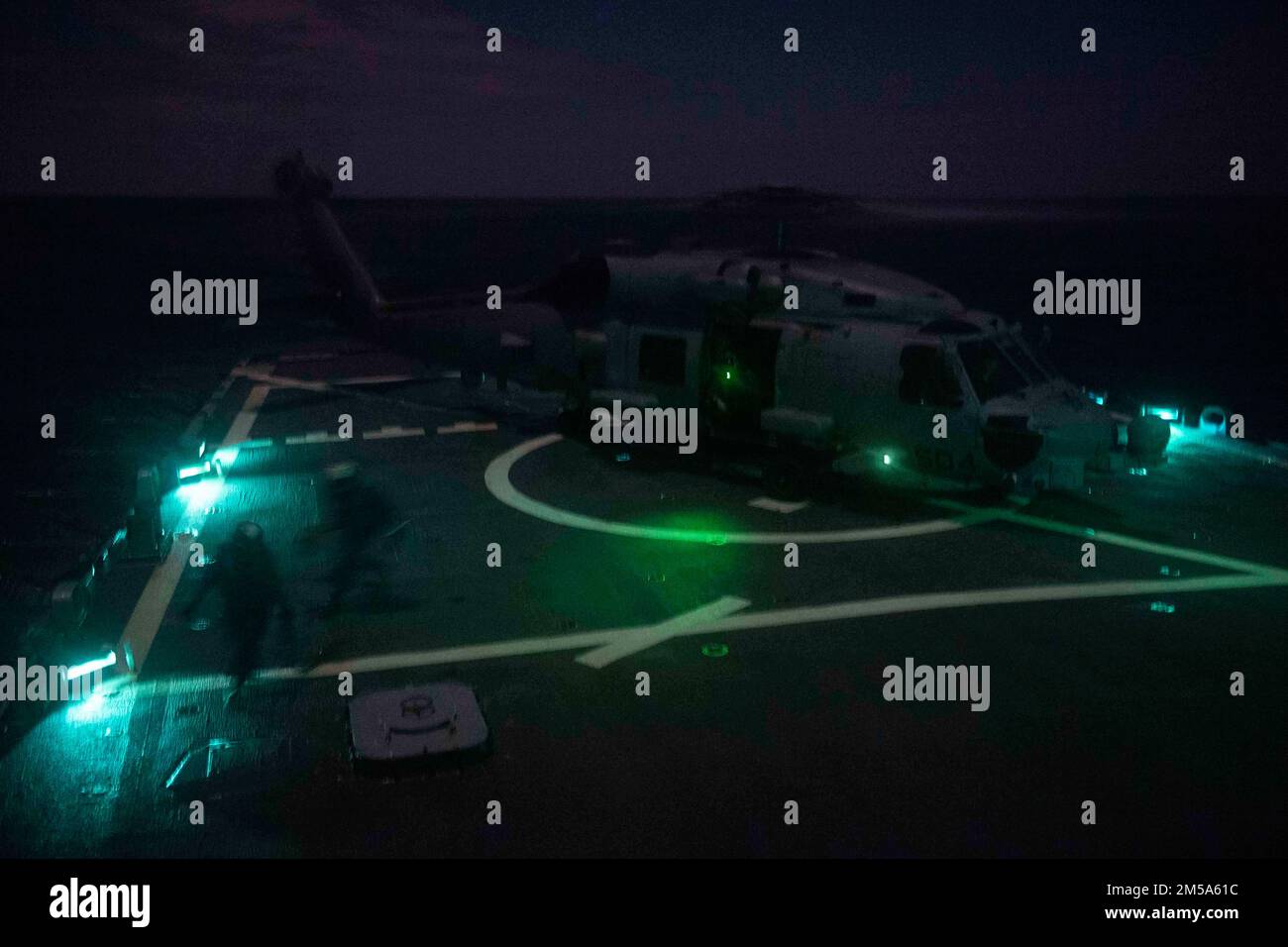 220214-N-QY794-1213 IONIAN SEA (Feb. 14, 2022) An MH-60R Sea Hawk helicopter, assigned to the “Proud Warriors” of Helicopter Maritime Strike Squadron (HSM) 72, prepares to take off during nighttime deck landing qualifications on the flight deck of the Arleigh Burke-class guided-missile destroyer USS Gonzalez (DDG 66), Feb. 14, 2022. Gonzalez is deployed with the Harry S. Truman Carrier Strike Group on a scheduled deployment in the U.S. Sixth Fleet area of operations in support of naval operations to maintain maritime stability and security, and defend U.S. allied and partner interests in Europ Stock Photo