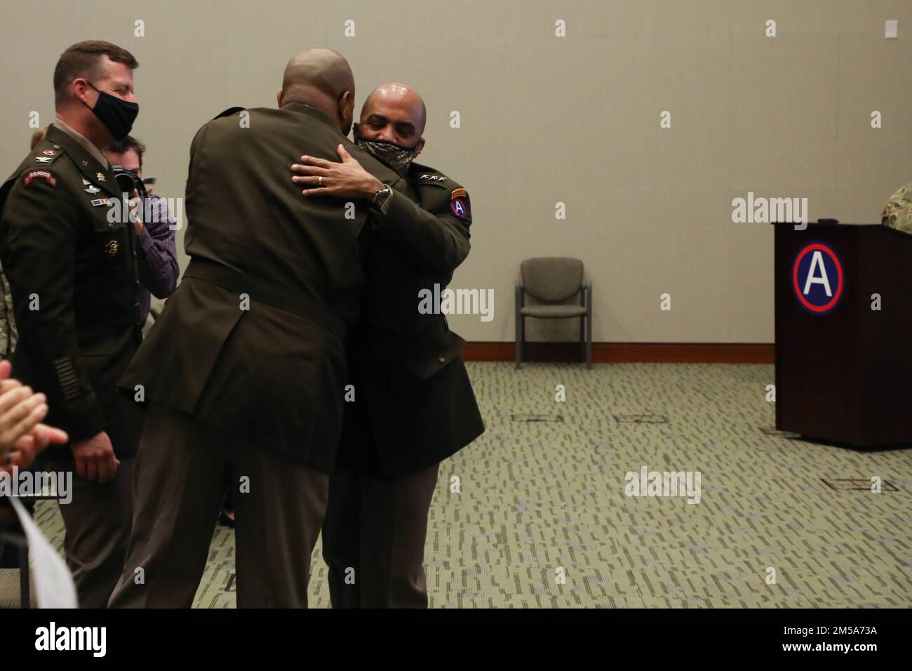 Lt. Gen. Ronald Clark, U.S. Army Central Commanding General hugs Col