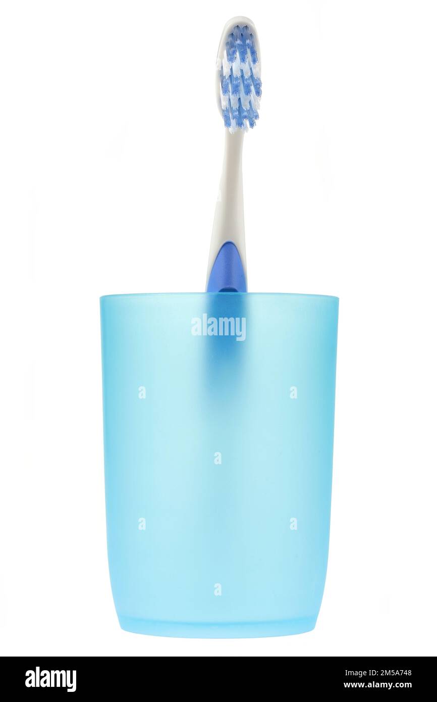toothbrush in tooth mug isolated on white background Stock Photo