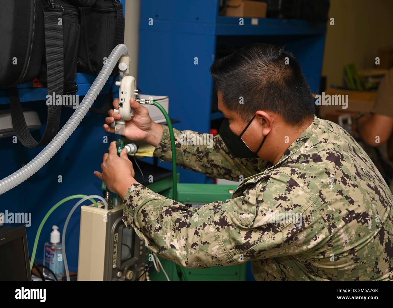 220215-N-UJ449-1011 NAVAL AIR STATION SIGONELLA, Italy (Feb. 15, 2022)— Hospital Corpsman 1st Class Victoriano Rosales, from San Diego, assigned to U.S. Navy Medicine and Readiness Training Command Sigonella, performs maintenance on a portable ventilator on Naval Air Station Sigonella, Feb. 15, 2022. NAS Sigonella’s strategic location enables U.S., allied, and partner nation forces to deploy and respond as required, ensuring security and stability in Europe, Africa and Central Command. Stock Photo