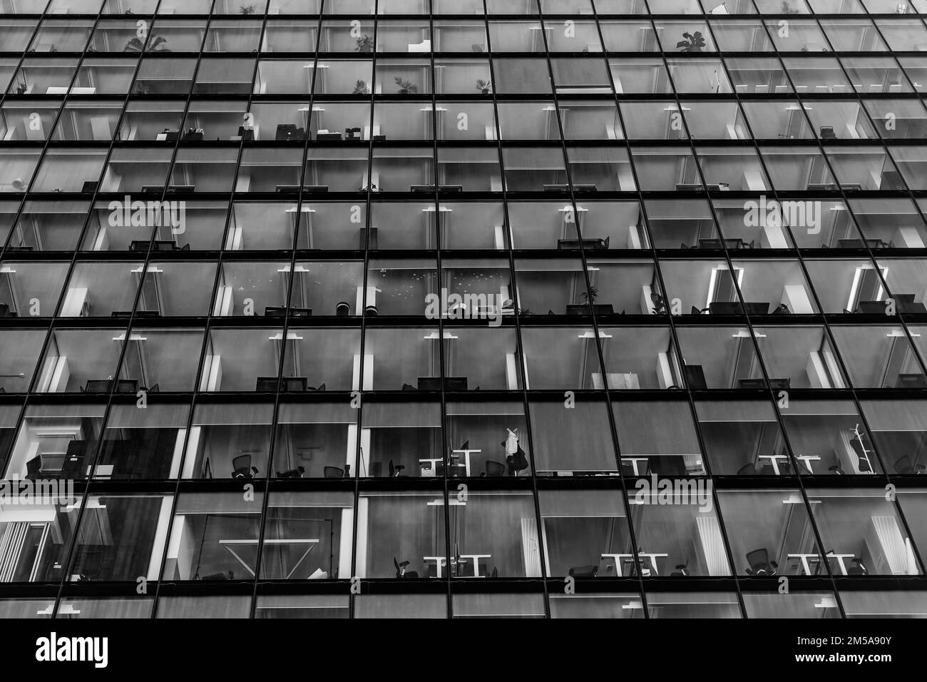 An empty office block over the Christmas Holidays,with added impact as a black and white image.Looking upwards with dramatic effect.Tall modern office Stock Photo