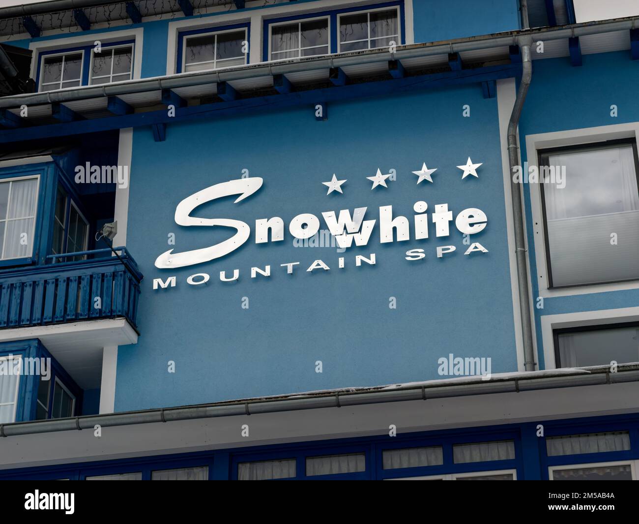 Snowwhite Mountain SPA logo on the building exterior of the hotel facade. Winter sport tourism in the European Alps. Ski holidays for winter sport. Stock Photo