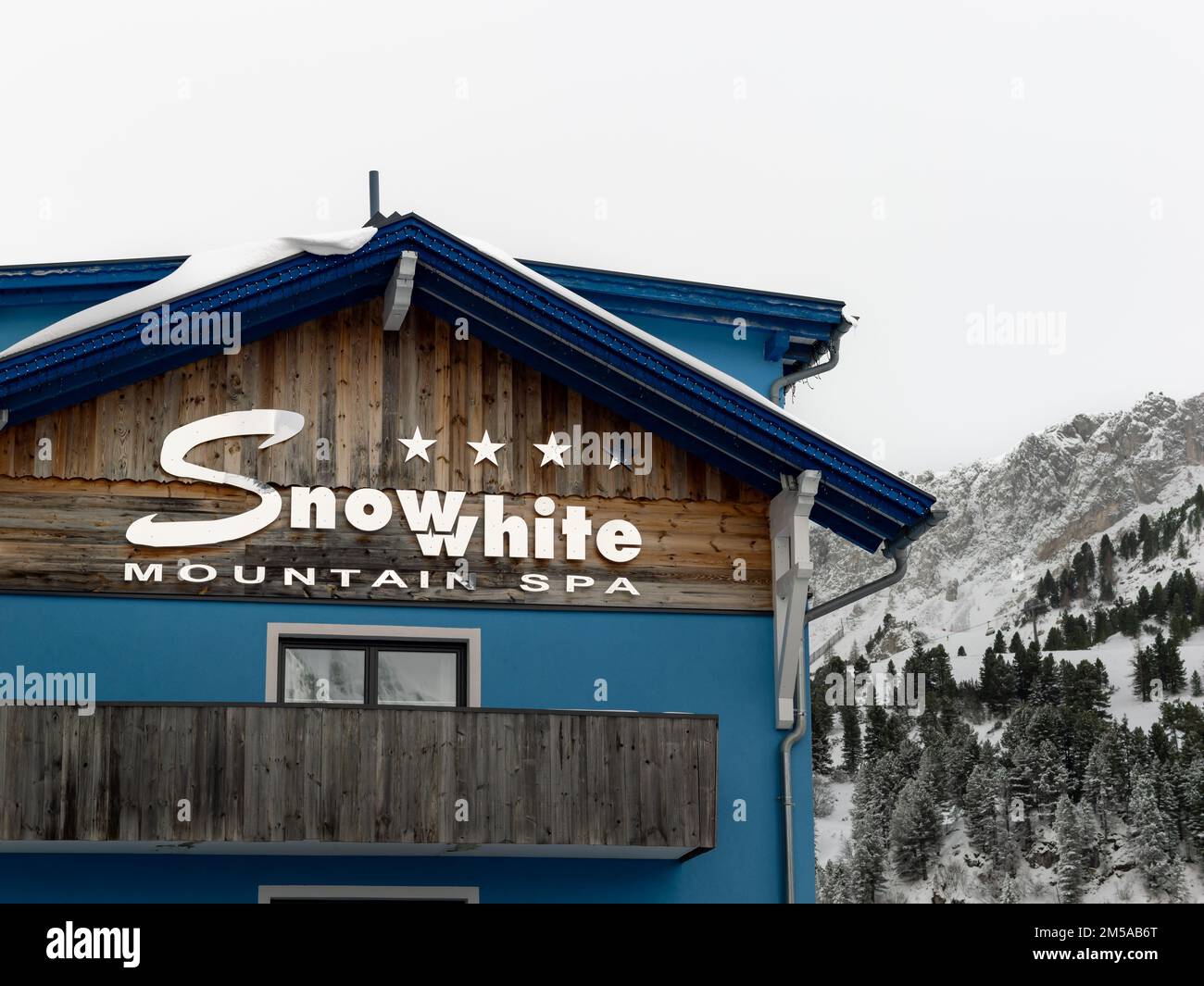 Snowwhite Mountain SPA logo on the building exterior of the hotel facade. Winter sport tourism in the European Alps. Ski holidays in the ski resort. Stock Photo