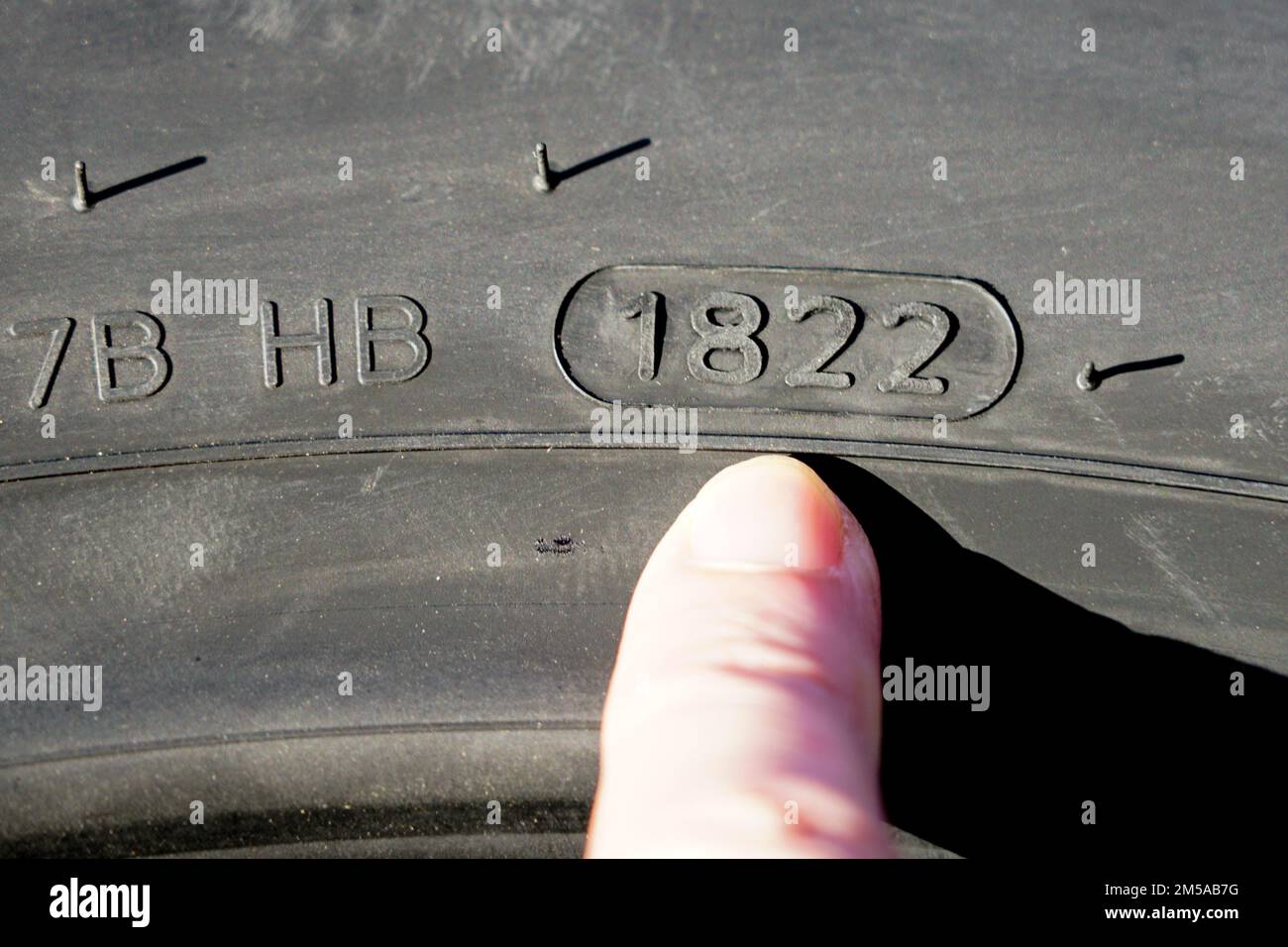 Side view of new tire with designation of week and year of tire