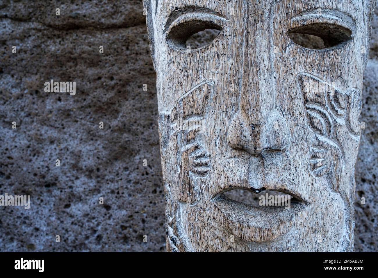 Carved wooden mask as decoration on the beach at Fanabe, Las Americas ...