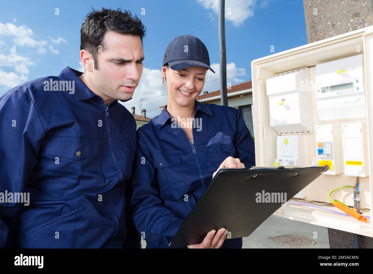 apprentice at work with engineer outdoors Stock Photo