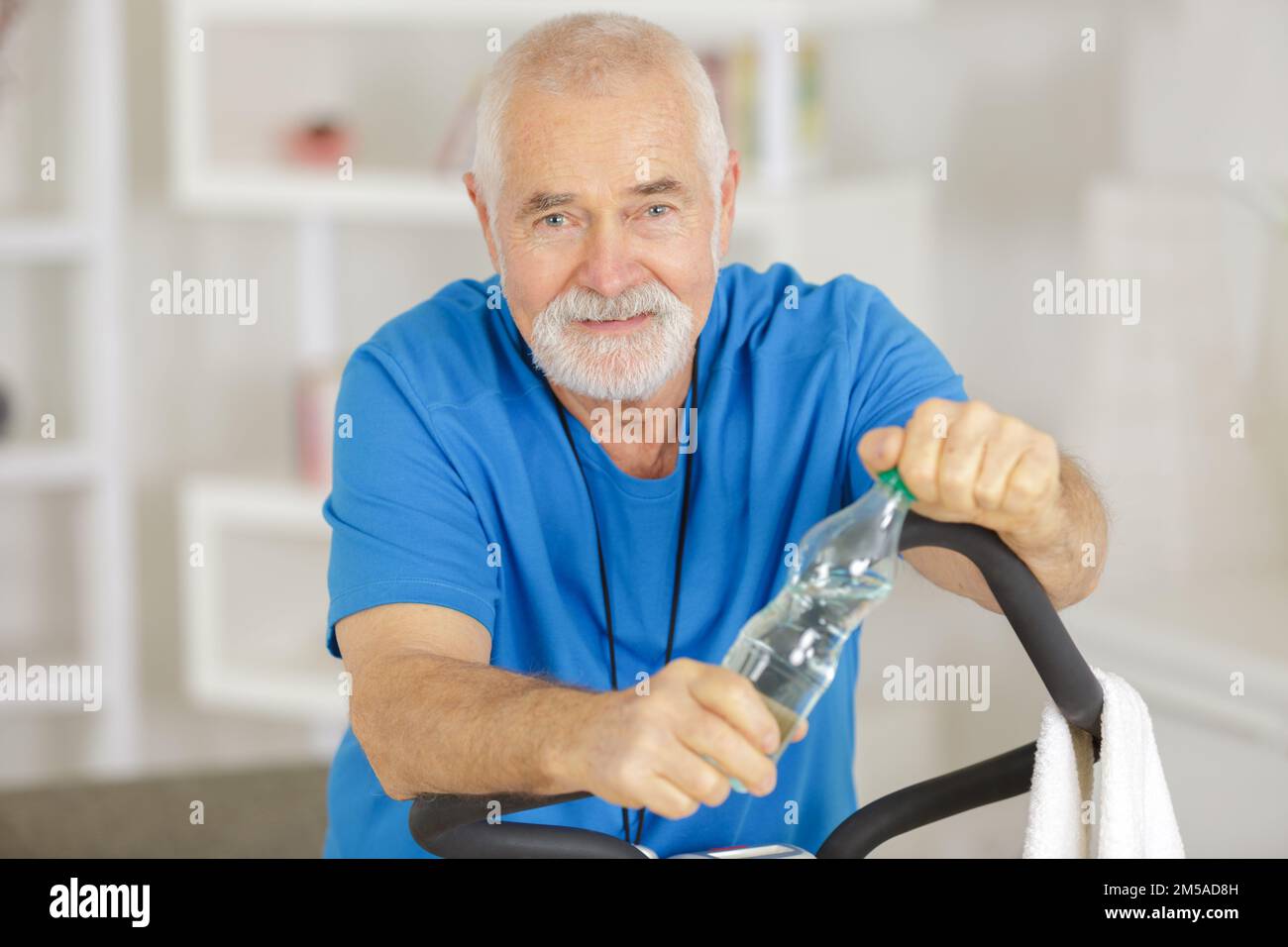 senior man drinking from water bottle Stock Photo - Alamy