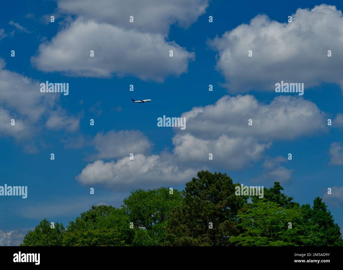 Airplane blue sky clouds hi-res stock photography and images - Alamy