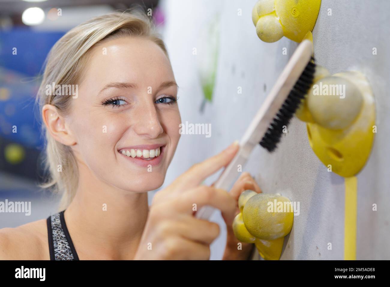 rock climbing woman cleaning indoors rock Stock Photo Alamy