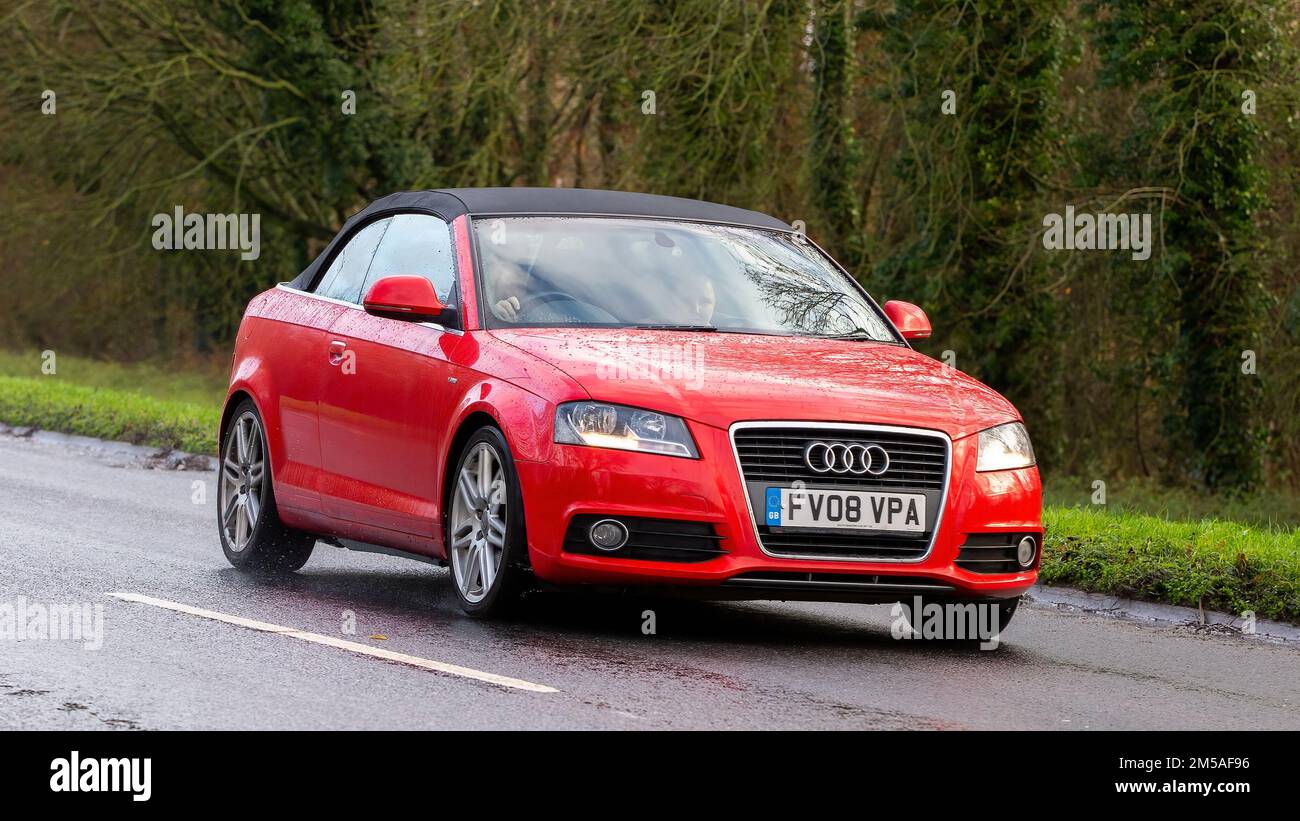 2008 red Audi A3 driving on a wet road Stock Photo