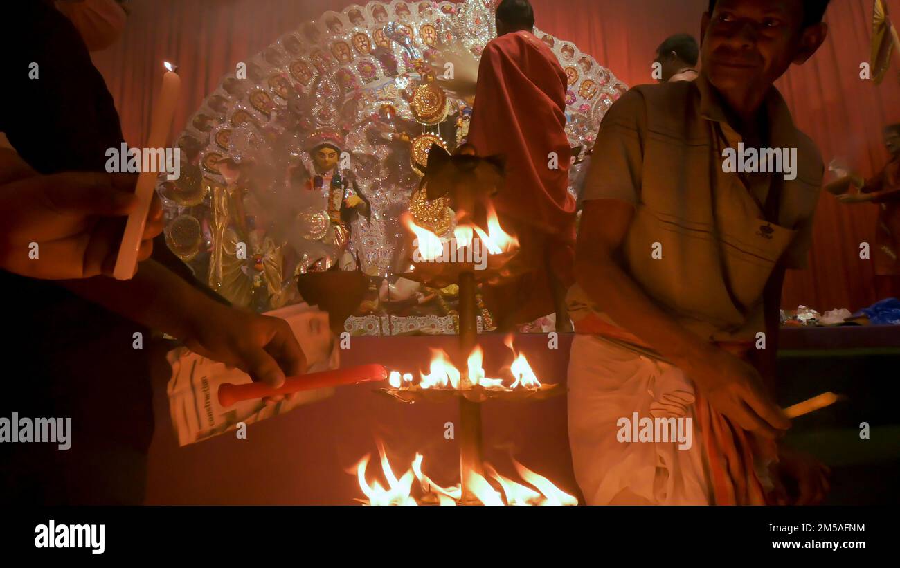Howrah, India - October 15th, 2021 : Devotee lighting up 108 lamps ...
