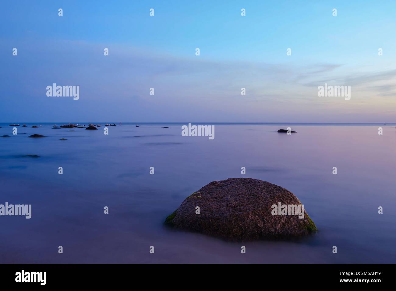 Sunset over the Baltic Sea on the beach of Ostersomarken, Bornholm Island, Denmark, Scandinavia, Europe. Stock Photo