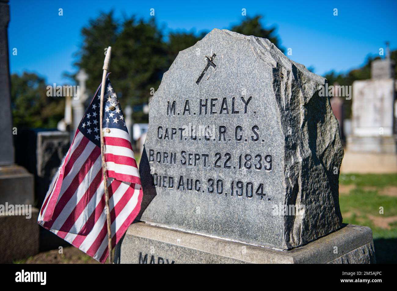 U.S. Revenue Cutter Service Capt. Micheal A. Healy’s headstone as shown at the Holy Cross Cemetery in Colma, Calif., Feb. 16, 2022. In 1864 Healy applied for a commission in the U.S. Revenue Marine and was accepted as a Third Lieutenant, his commission being signed by President Abraham Lincoln. Stock Photo