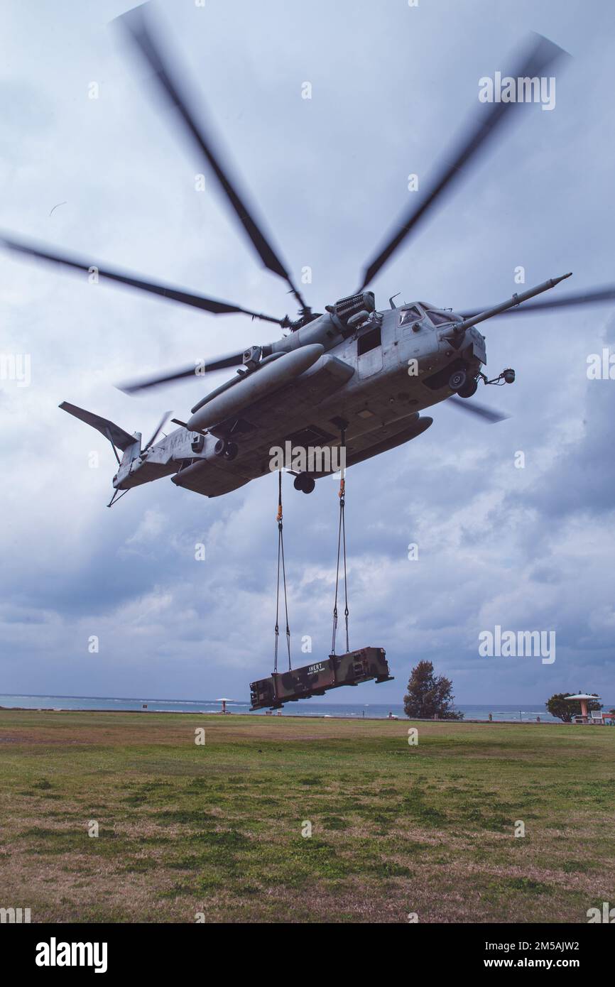 A U.S. Marine Corps CH-53E Super Stallion helicopter assigned to Marine Heavy Helicopter Squadron (HMH) 466 lifts a MM-104 Patriot canister in support of Jungle Warfare Exercise 22 at Torii Station, Okinawa, Japan, Feb. 16, 2022. JWX is a large-scale field training exercise focused on leveraging the integrated capabilities of joint and allied partners to strengthen all-domains awareness, maneuver, and fires across a distributed maritime environment. Stock Photo