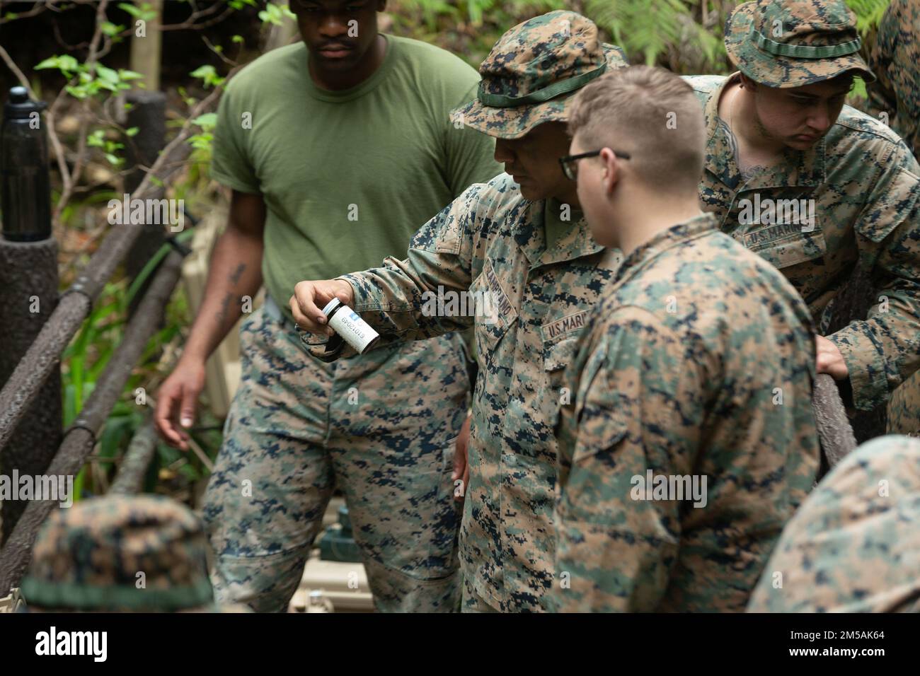 U.S. Marines with Combat Logistics Battalion 4, Combat Logistics Regiment 3, 3rd Marine Logistics Group, conduct water purification using the Platoon Water Purification System during Jungle Warfare Exercise 22, Feb. 16, 2022, Camp Gonsalves, Okinawa, Japan. JWX 22 is a large-scale field training exercise focused on leveraging the integrated capabilities of joint and allied partners to strengthen all-domain awareness, maneuver, and fires across a distributed maritime environment. Stock Photo