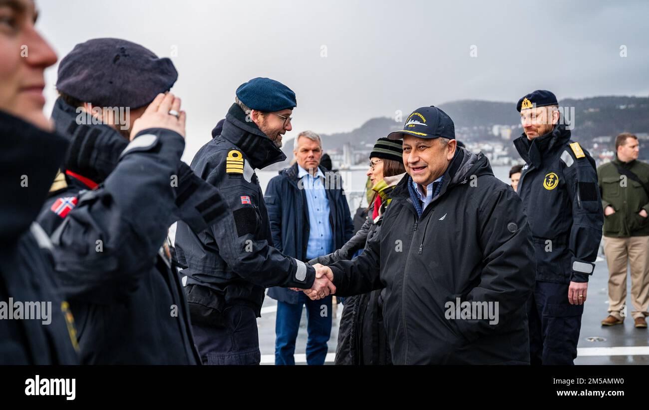 BERGEN, Norway (Feb. 16, 2022) — Secretary of the Navy Carlos Del Toro renders honors to the Norwegian flag and crew of HNoMS Thor Heyerdahl (F314), in Bergen, Norway, Feb. 16, 2022. Secretary Del Toro is in Norway to visit U.S. service members and Norwegian government leaders to reinforce existing bilateral and multilateral security relationships between the U.S. Navy and the Royal Norwegian Navy. Stock Photo