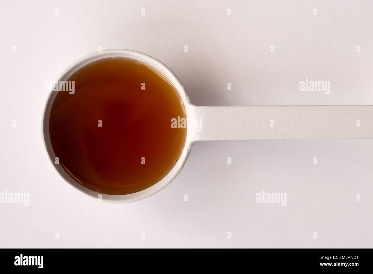 Maple Syrup in a Teaspoon Stock Photo