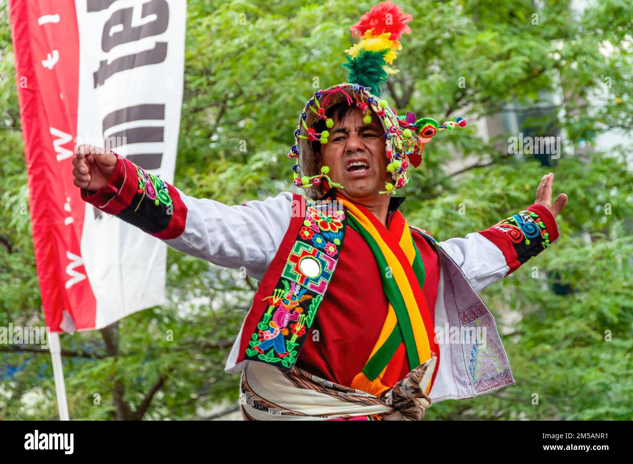 A member of the Grupo Llasas (Bolivia) dances in the stage wearing traditional clothes. The annual event is held in Mel Lastman square. Stock Photo