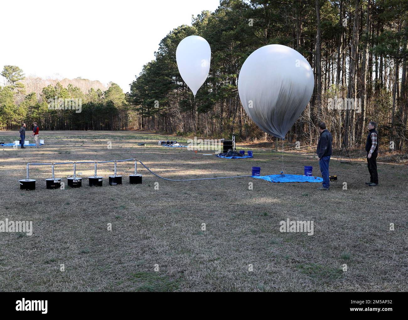 Joint Expeditionary Base Little Creek-Fort Story, Virginia (Feb. 23, 2022) Representatives and science advisors from the Office of Naval Research, along with personnel from Navy Expeditionary Combat Command, conduct a rapid hydrogen production evolution as part of a science and technology demonstration.  The collaborative effort utilized the hydrogen production for a balloon lift in support of communications relay capability.  The demonstration was part of an ongoing relationship between the two organizations to explore ideas, technologies, and concepts which have potential application within Stock Photo