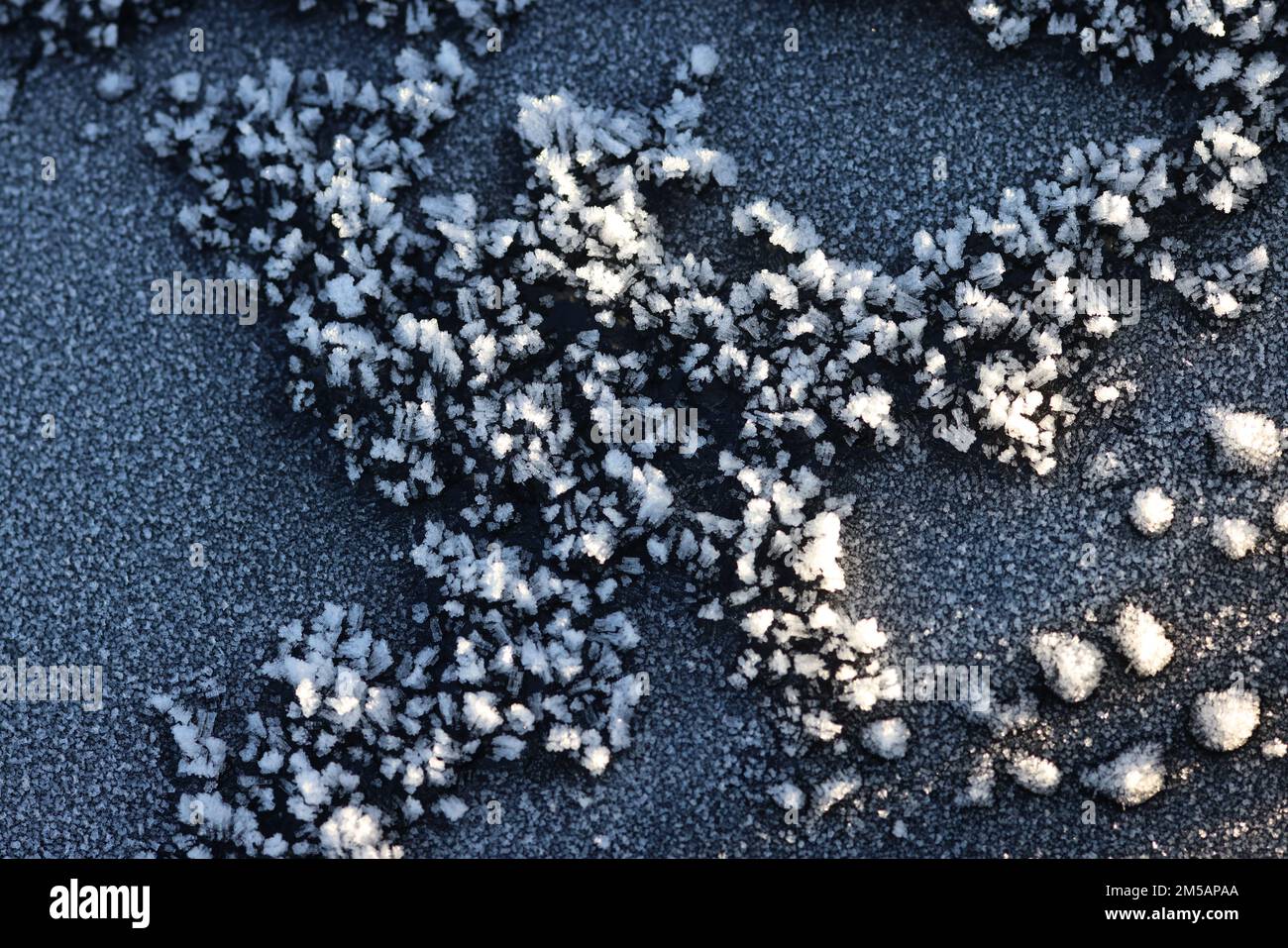 Ice patterns on car bonnet Stock Photo