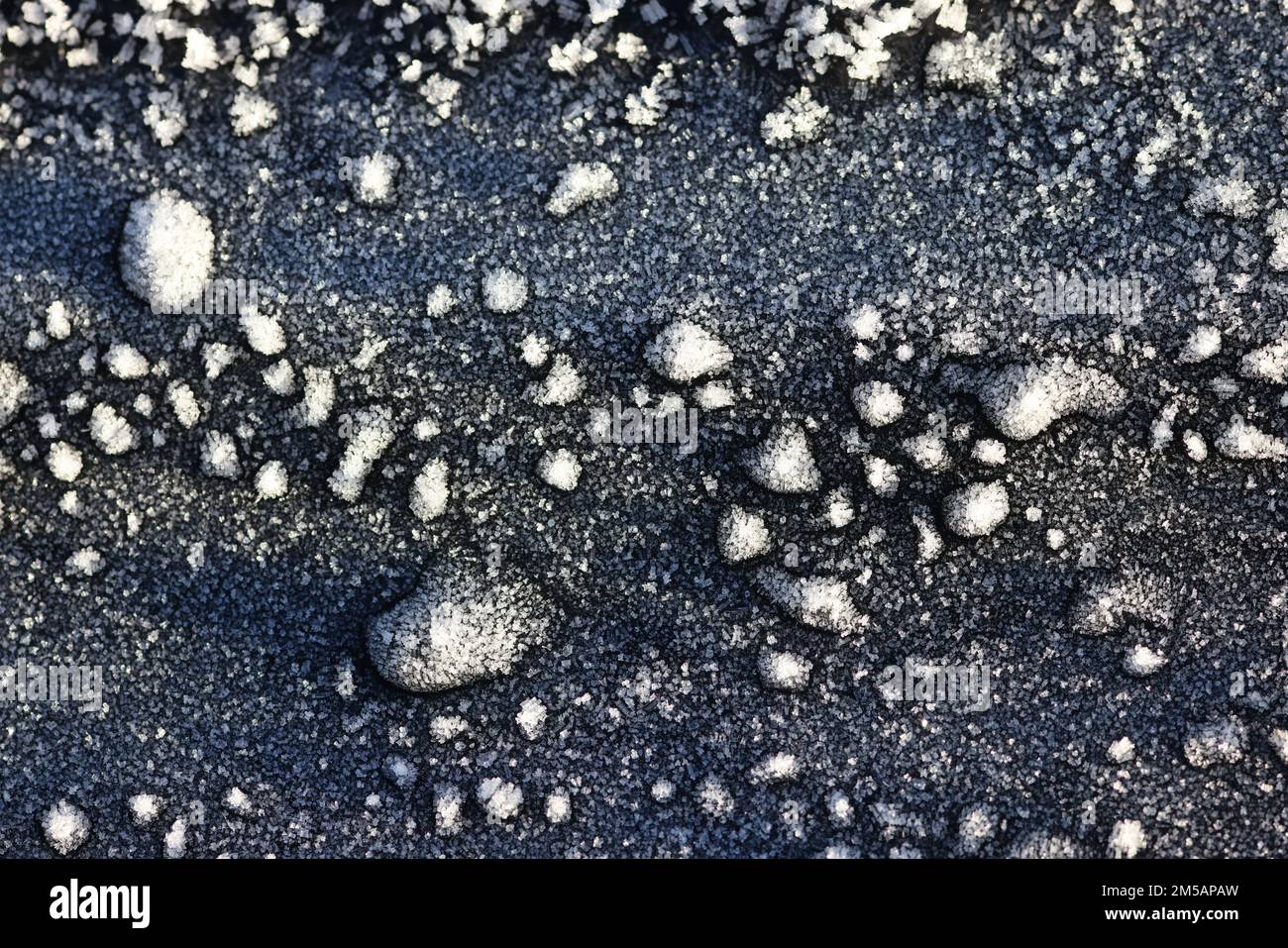 Ice patterns on car bonnet Stock Photo