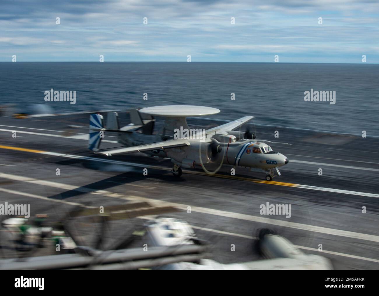 220216-N-WD859-1177 ATLANTIC OCEAN (Feb. 16, 2022) An E2-D “Hawkeye” aircraft, attached to Carrier Airborne Early Warning Squadron (VAW) 121, lands on the flight deck of the aircraft carrier USS George H.W. Bush (CVN 77) during Tailored Ship’s Training Availability/Final Evaluation Problem (TSTA/FEP), Feb. 16. TSTA/FEP is a multi-phase training evolution designed to give the crew a solid foundation of unit-level operating proficiency and to enhance the ship’s ability to self-train. George H.W. Bush provides the national command authority flexible, tailorable war fighting capability through the Stock Photo