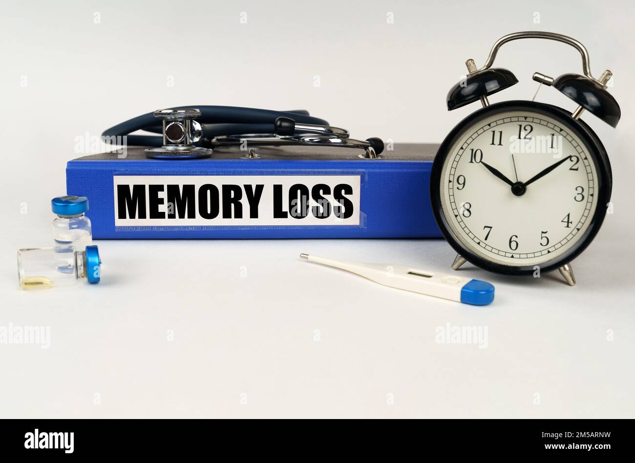 Medical concept. On a white surface, a thermometer, ampoules, a ...