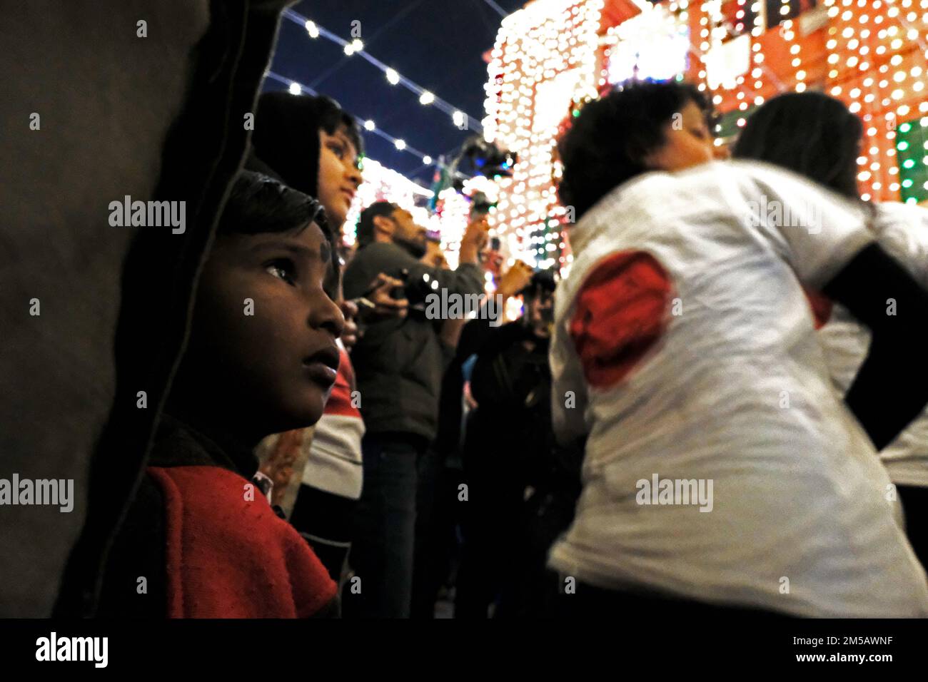 Kolkata, India. 24th Dec, 2022. Christmas evening is celebrated at Bow Barrack. Numerous events are being taken place. Hundreds of people are gathered here for Christmas evening in Kolkata, India on Dec. 24, 2022. (Photo by Swattik Jana/Pacific Press/Sipa USA) Credit: Sipa USA/Alamy Live News Stock Photo