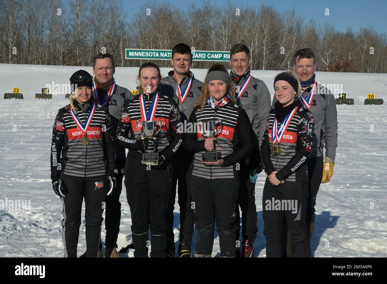 The North Dakota National Guard biathlon team from back row left to right Capt Blake Hillerson, 1st Battalion, 112 Aviation Regiment, Staff Sgt. Brandon Pulst, Camp Grafton Training Center, Chief Warrant Officer 2 Wynn Roberts, Company D, 1st Battalion, 112 Aviation Regiment, Staff Sgt. Joshua Warmbold, of the 141 Maneuver Enhancement Brigade, front row, Senior Master Sgt. Danelle Card, of the 119th Wing, Spc. Sydney Kautz, of the 188th Engineer Company, 2nd Lt. Kandis Matelski, of the 141 Maneuver Enhancement Brigade, and 2nd Lt. Kaitlyn Gura, of the 1,188th Air Defense Artillery Regiment. Th Stock Photo