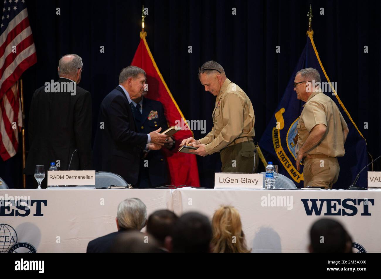 U.S. Marine Lt. Gen. Matthew G. Glavy, the deputy commandant for information, receives a book during the West 2022 Conference at the San Diego Convention Center in San Diego, California, Feb. 17, 2022. Throughout West 22, leaders from the Navy, Marine Corps and Coast Guard discussed modernization efforts and future concepts that support the Sea Services' operations. West 22 provides a venue for senior military and government officials to gain valuable direct feedback from operators and partners in the industry. Stock Photo