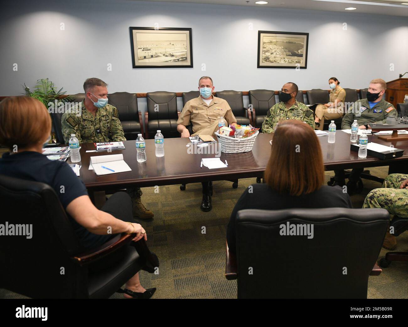 220217-N-DB801-0331  MAYPORT, Fla. – (Feb. 17, 2022) – Rear Adm. Jim Aiken, Commander, U.S. Naval Forces Southern Command/U.S. 4th Fleet, third from left, speaks with retired Rear Adm. Dawn Cutler, Executive Vice President and Chief Operations Officer at Navy-Marine Corps Relief Society (NMCRS), left, and local leadership at a meeting on Naval Base Mayport, Feb. 17, 2022. The NMCRS is a non-profit organization that provides financial and educational assistance to active duty Marines and Sailors and their families. The organization provides loans, COVID-19 assistance, visiting nurses, emergency Stock Photo