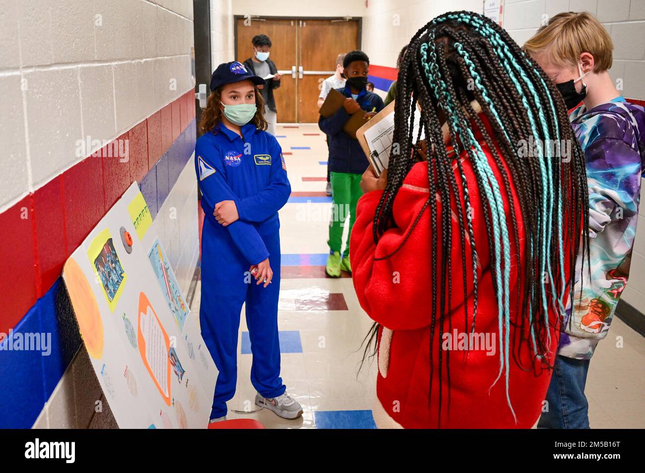 Dressed in a NASA flight suit, Elisabeth Enoch portrays teacher and astronaut Christa McAuliffe Feb, 17, 2022, during the C.C. Pinckney Elementary School’s Living History Museum. Each student picked a historical figure and researched their lives and deeds to speak about them to their peers during the event. Stock Photo