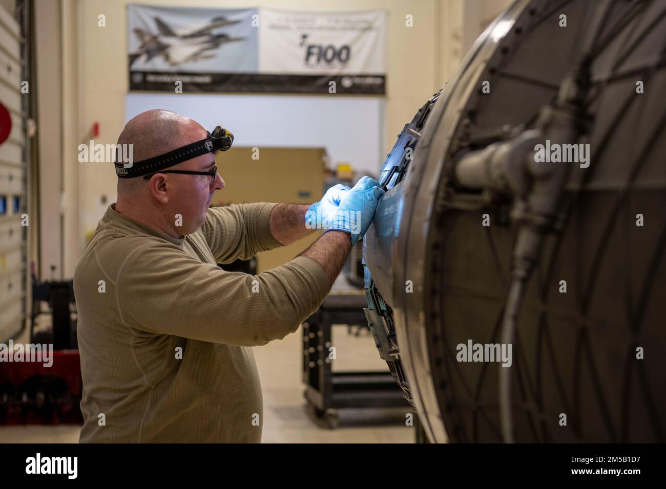 U.S. Air Force Staff Sgt. Anthony Di Valentin, an aerospace propulsion  technician, assigned to the Ohio National Guard's 180th Fighter Wing, works  on the engine of an F-16 Fighting Falcon at the