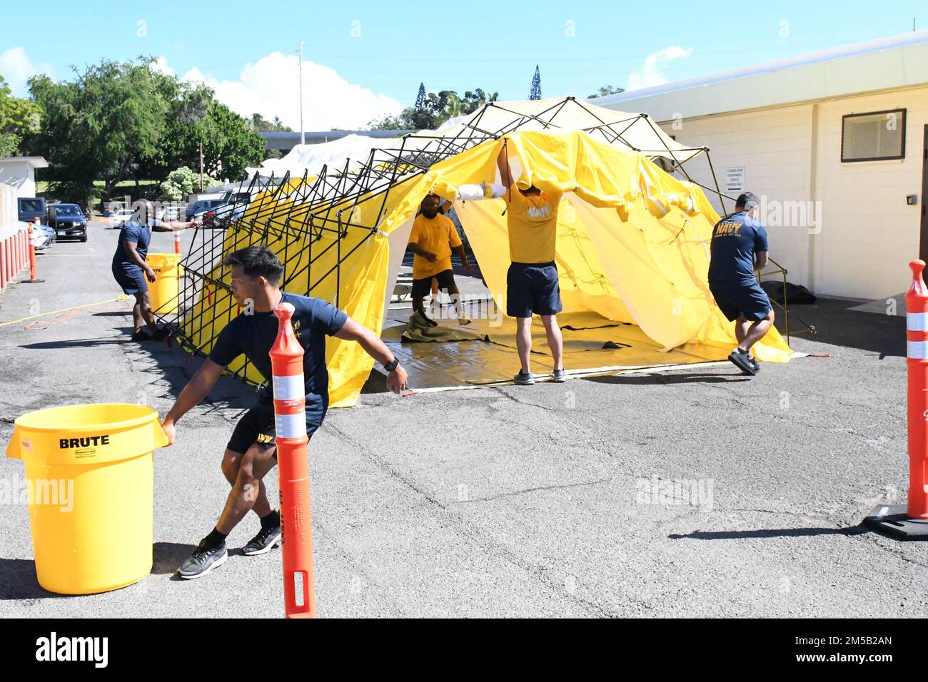 Sailors from Navy Medicine Readiness and Training Command Pearl Harbor set up a decontamination tent as part of the First Receiver Operations Training (FROT) held at Branch Health Clinic Makalapa on February 17, 2022. This yearly requirement teaches Sailors to properly decontaminate patients prior to administering medical care in the event of a Chemical, Biological, Radiological, or Nuclear (CBRN) incident. Stock Photo