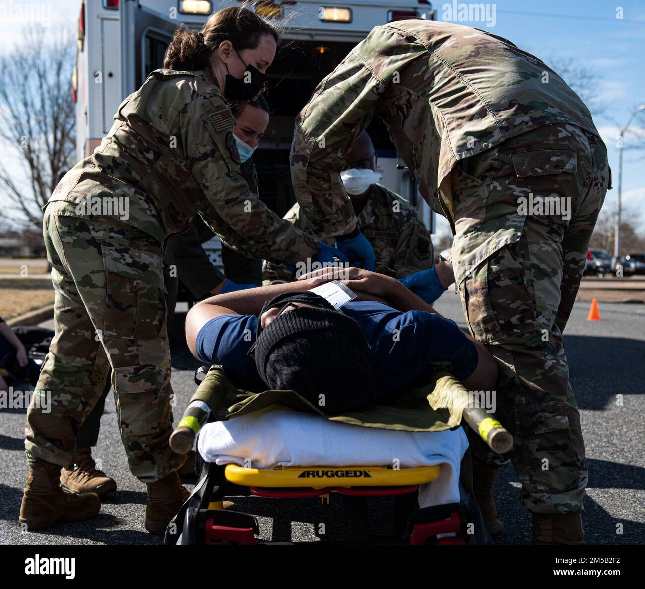 U.S. Airmen from the 633d Medical Group assess an actor participating in a Chemical, Biological, Radiological and Nuclear training exercise at Joint Base Langley-Eustis, Virginia, Feb. 17, 2022. Members from the 633d Air Base Wing performed the CBRN exercise as a part of an 18-month training requirement for Active Duty members in order to properly equip units for going down range. Stock Photo