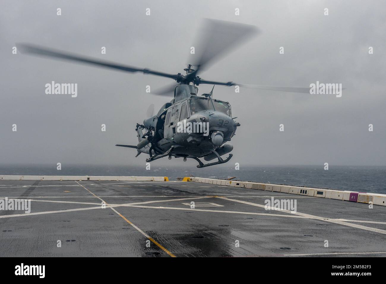 PHILIPPINE SEA (Feb. 17, 2022) A UH-1Y Huey helicopter from Marine Medium Tiltrotor Squadron (VMM) 265 takes off from the flight deck of the amphibious transport dock ship USS Green Bay (LPD 20). Green Bay, part of Expeditionary Strike Group 7, along with the 31st Marine Expeditionary Unit (MEU), is operating in the U.S. 7th Fleet area of responsibility to enhance interoperability with allies and partners and serve as a ready response force to defend peace and stability in the Indo-Pacific region. Stock Photo
