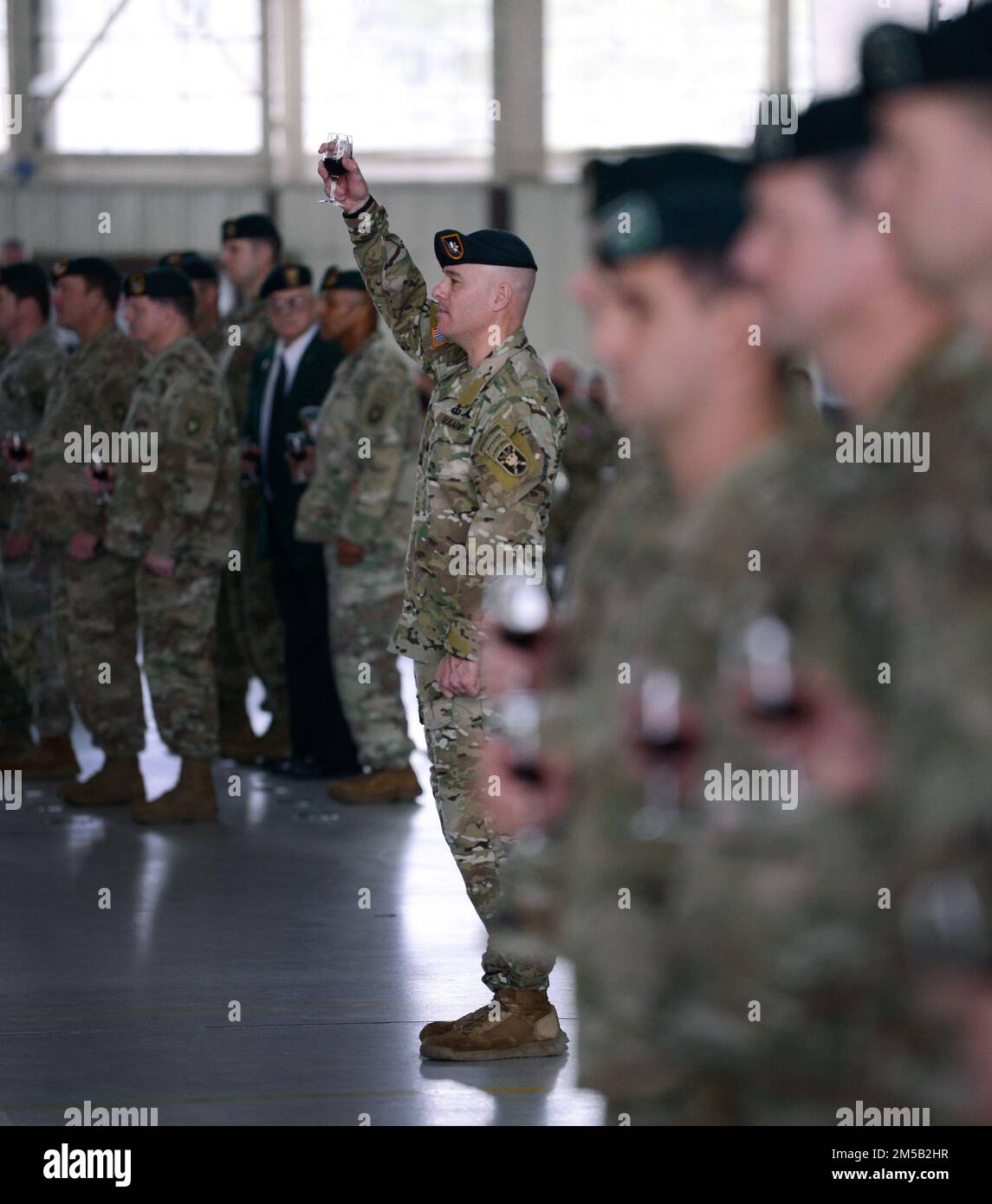 Lieutenant Colonel Patrick Toohey, commander, 4th Battalion, 1st Special Warfare Training Group (Airborne) toasts the Special Forces Regiment during a graduation ceremony at Fort Bragg, North Carolina February 17, 2022. The ceremony marked the completion of the Special Forces Qualification Course where Soldiers earned the honor of wearing the green beret, the official headgear of Special Forces. Stock Photo
