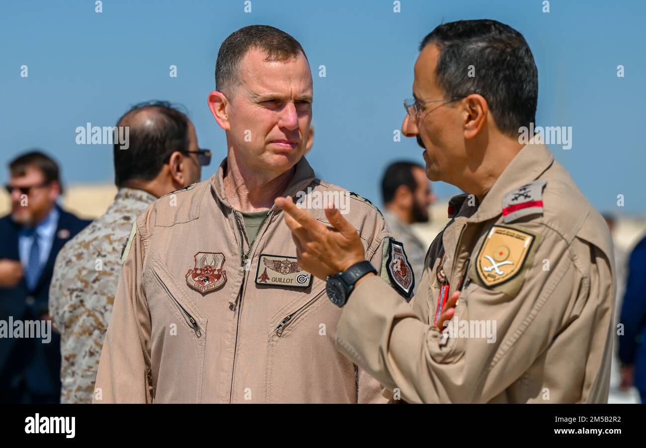Lt. Gen. Gregory M. Guillot, Ninth Air Force (Air Forces Central) commander, speaks with Lt. Gen. Turki bin Bandar bin Abdulaziz, Royal Saudi Air Force commander, during the multinational RSAF led exercise, Spears of Victory at King Abdulaziz Air Base, Kingdom of Saudi Arabia, Feb. 17, 2022. Training with partner nations strengthens military-to-military relationships, improves interoperability and promotes regional stability. Stock Photo
